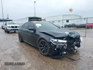 2019 BMW M5 Competition z VIN WBSJF0C56KB448625, wystawiony jako IAAI lot #41368521 z przebiegiem 56 611 mil mil oraz . Historia ofert i sprzedaży dostępna na DreamBid. Obrazek 1.