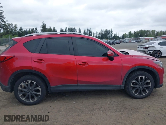 2016 Mazda CX-5 Grand Touring z VIN JM3KE4DY7G0687318, wystawiony jako IAAI lot #42228585 z przebiegiem 188 793 mil mil oraz . Historia ofert i sprzedaży dostępna na DreamBid. Obrazek 13.