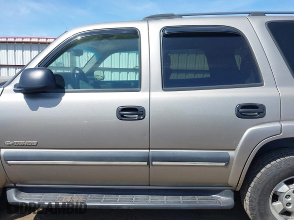 2003 Chevrolet Tahoe LT with VIN 1GNEK13Z93J329737, listed as a IAAI auction lot 42212884 with 232,514 mi miles and . Bid and sale history available at DreamBid. Image 14.