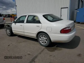 2000 Mazda 626 LX z VIN 1YVGF22C3Y5165341, wystawiony jako Copart lot #56575075 z przebiegiem 58 645 mil mil oraz Szkody całkowita. Historia ofert i sprzedaży dostępna na DreamBid. Obrazek 2.