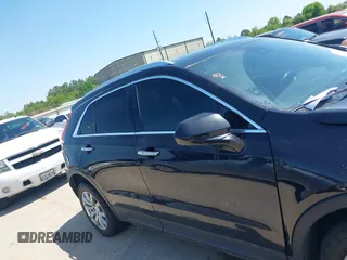2019 Cadillac XT4 FWD Premium Luxury with VIN 1GYFZCR48KF141478, listed as a IAAI auction lot 41988092 with 53,970 mi miles and . Bid and sale history available at carsss.com. Image 13.