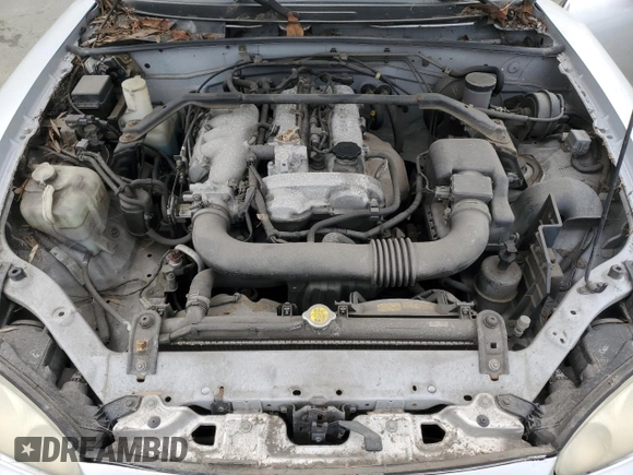 2004 Mazda MX-5 Miata LS with VIN JM1NB353440402453, listed as a Copart auction lot 45064475 with 151,508 mi miles and Salvage title. Bid and sale history available at DreamBid. Image 11.
