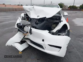 2022 Tesla Model Y Performance with VIN 7SAYGDEFXNF384268, listed as a IAAI auction lot 41558359 with 33,870 mi miles and . Bid and sale history available at DreamBid. Image 11.