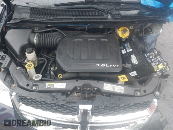 2016 Dodge Grand Caravan SE with VIN 2C4RDGBG3GR258639, listed as a IAAI auction lot 41687082 with 99,616 mi miles and . Bid and sale history available at DreamBid. Image 10.