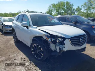 2016 Mazda CX-5 Grand Touring z VIN JM3KE4DY3G0748891, wystawiony jako IAAI lot #42249810 z przebiegiem 40 093 mil mil oraz . Historia ofert i sprzedaży dostępna na DreamBid. Obrazek 1.