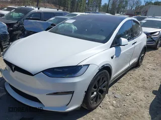 2023 Tesla Model X with VIN 7SAXCDE50PF414198, listed as a IAAI auction lot 41880957 with Not Provided miles and . Bid and sale history available at DreamBid. Image 2.