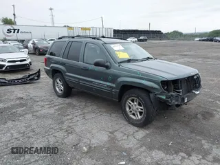 2004 Jeep Grand Cherokee Laredo with VIN 1J4GW48S24C276284, listed as a IAAI auction lot 42596655 with 142,524 mi miles and . Bid and sale history available at DreamBid. Image 1.
