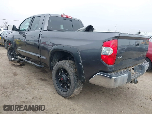 2014 Toyota Tundra SR with VIN 5TFUM5F16EX052444, listed as a IAAI auction lot 42298372 with 121,876 mi miles and . Bid and sale history available at DreamBid. Image 3.