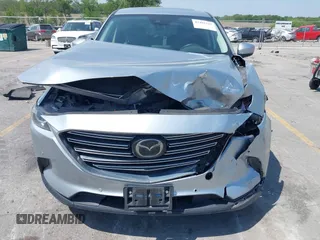 2020 Mazda CX-9 Touring with VIN JM3TCBCY2L0415513, listed as a IAAI auction lot 42481543 with 47,294 mi miles and . Bid and sale history available at DreamBid. Image 6.