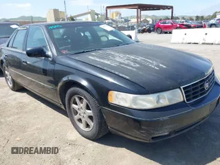 1998 Cadillac Seville STS z VIN 1G6KY5499WU916185, wystawiony jako IAAI lot #42035783 z przebiegiem 164 763 mil mil oraz . Historia ofert i sprzedaży dostępna na DreamBid. Obrazek 1.