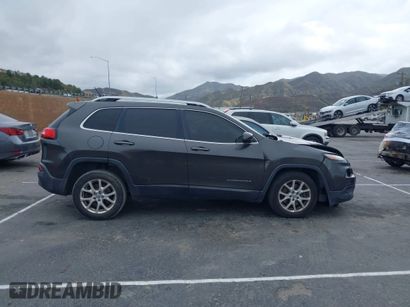 2014 Jeep Cherokee Latitude z VIN 1C4PJLCS2EW217130, wystawiony jako IAAI lot #41782039 z przebiegiem 129 080 mil mil oraz . Historia ofert i sprzedaży dostępna na DreamBid. Obrazek 13.