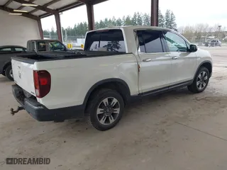 2017 Honda Ridgeline RTL-E with VIN 5FPYK3F7XHB030551, listed as a IAAI auction lot 41903844 with 153,594 mi miles. Bid and sale history available at carsss.com. Image 4.