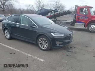 2019 Tesla Model X 75D with VIN 5YJXCDE21KF156446, listed as a IAAI auction lot 41726220 with 73,027 mi miles. Bid and sale history available at carsss.com. Image 1.