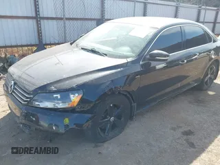 2015 Volkswagen Passat 1.8T Limited Edition with VIN 1VWAT7A36FC118099, listed as a IAAI auction lot 41919223 with 103,916 mi miles. Bid and sale history available at carsss.com. Image 2.