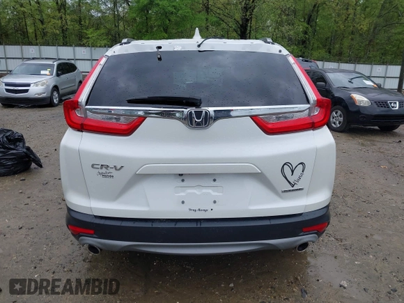 2018 Honda CR-V Touring z VIN 5J6RW1H96JL014087, wystawiony jako IAAI lot #41931640 z przebiegiem Nie podano mil oraz . Historia ofert i sprzedaży dostępna na DreamBid. Obrazek 17.