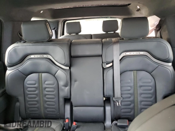 2023 Rivian R1S Adventure z VIN 7PDSGABAXPN019516, wystawiony jako Copart lot #73248104 z przebiegiem 11 525 mil mil oraz Szkody całkowita. Historia ofert i sprzedaży dostępna na DreamBid. Obrazek 10.