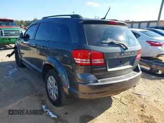 2018 Dodge Journey SE with VIN 3C4PDCABXJT183318, listed as a IAAI auction lot 40985444 with 164,051 mi miles. Bid and sale history available at carsss.com. Image 3.