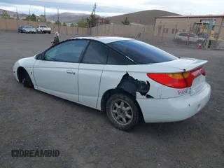 2002 Saturn SC with VIN 1G8ZR12762Z212309, listed as a IAAI auction lot 41857740 with 204,209 mi miles. Bid and sale history available at carsss.com. Image 3.