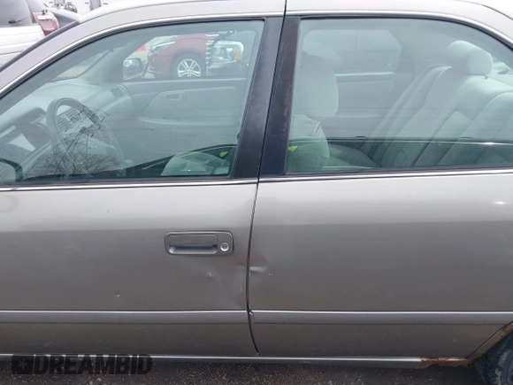 2001 Toyota Camry CE with VIN 4T1BG22K01U060588, listed as a IAAI auction lot 42040071 with 165,446 mi miles and . Bid and sale history available at DreamBid. Image 14.