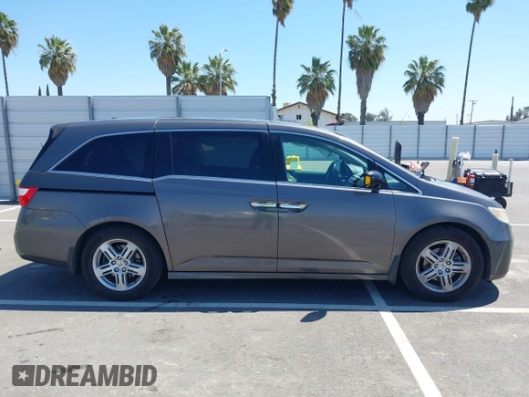 2012 Honda Odyssey Touring with VIN 5FNRL5H98CB011297, listed as a IAAI auction lot 42207061 with 154,073 mi miles and . Bid and sale history available at DreamBid. Image 13.