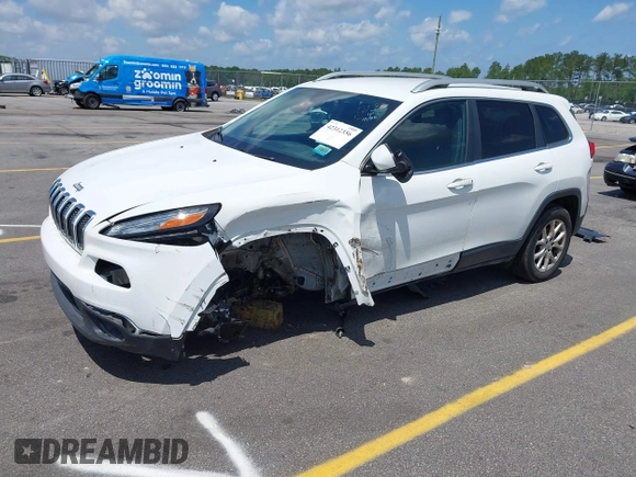 2016 Jeep Cherokee Latitude with VIN 1C4PJLCB0GW291357, listed as a IAAI auction lot 42312356 with 105,692 mi miles and . Bid and sale history available at DreamBid. Image 2.