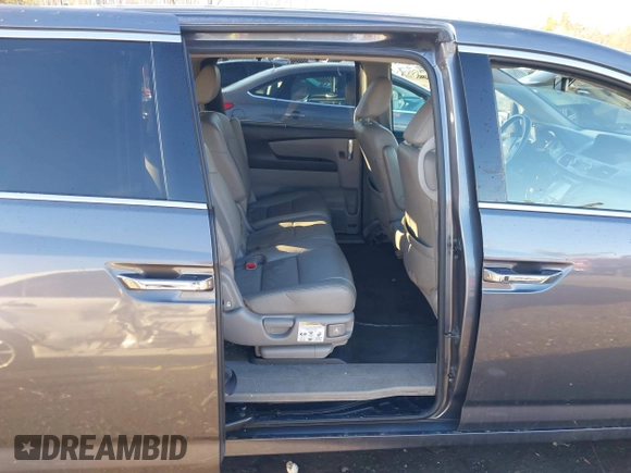 2014 Honda Odyssey Touring with VIN 5FNRL5H94EB081267, listed as a IAAI auction lot 41199509 with 146,827 mi miles and . Bid and sale history available at DreamBid. Image 8.