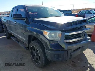 2014 Toyota Tundra 4WD Truck SR with VIN 5TFUM5F17EX051674, listed as a IAAI auction lot 41296906 with 140,782 mi miles. Bid and sale history available at carsss.com. Image 1.