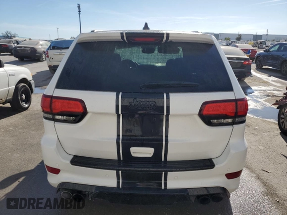2019 Jeep Grand Cherokee Trackhawk with VIN 1C4RJFN92KC564748, listed as a Copart auction lot 82677504 with 48,528 mi miles and Salvage title. Bid and sale history available at DreamBid. Image 6.