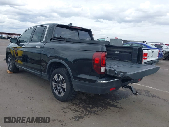 2017 Honda Ridgeline RTL-E with VIN 5FPYK3F7XHB030565, listed as a IAAI auction lot 41795386 with 79,252 mi miles and . Bid and sale history available at DreamBid. Image 3.