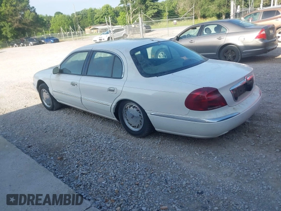 1998 Lincoln Continental z VIN 1LNLM97V1WY602564, wystawiony jako IAAI lot #42333637 z przebiegiem 142 234 mil mil oraz . Historia ofert i sprzedaży dostępna na DreamBid. Obrazek 3.