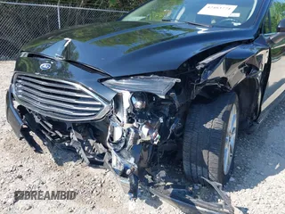 2017 Ford Fusion Hybrid SE with VIN 3FA6P0LU5HR344879, listed as a IAAI auction lot 42483771 with 146,603 mi miles and . Bid and sale history available at DreamBid. Image 6.
