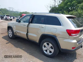 2011 Jeep Grand Cherokee Laredo with VIN 1J4RR4GG0BC713919, listed as a IAAI auction lot 42425229 with 139,379 mi miles and . Bid and sale history available at DreamBid. Image 3.