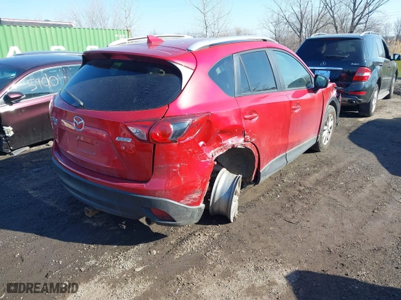 2016 Mazda CX-5 Touring with VIN JM3KE4CY0G0901356, listed as a IAAI auction lot 41641742 with 96,950 mi miles. Bid and sale history available at carsss.com. Image 4.