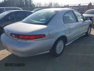 1996 Mercury Sable GS with VIN 1MELM50U5TG605997, listed as a IAAI auction lot 41751266 with 179,662 mi miles. Bid and sale history available at carsss.com. Image 4.