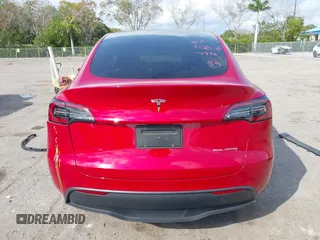 2023 Tesla Model Y Long Range with VIN 7SAYGDEE1PA154996, listed as a IAAI auction lot 41472595 with 24,861 mi miles and . Bid and sale history available at DreamBid. Image 16.