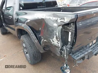 2018 Toyota Tacoma SR5 with VIN 3TMAZ5CN0JM061233, listed as a IAAI auction lot 41944668 with 94,314 mi miles and . Bid and sale history available at DreamBid. Image 6.
