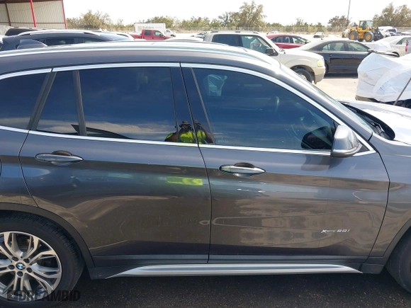 2017 BMW X1 xDrive28i with VIN WBXHT3Z33H4A65198, listed as a IAAI auction lot 41798503 with 88,951 mi miles. Bid and sale history available at carsss.com. Image 13.