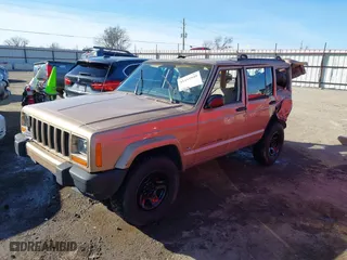 1999 Jeep Cherokee Sport with VIN 1J4FT68S7XL589206, listed as a IAAI auction lot 41411949 with 143,158 mi miles. Bid and sale history available at carsss.com. Image 18.