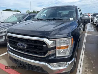 2021 Ford F-150 XL with VIN 1FTEW1CB8MFA73434, listed as a IAAI auction lot 42203245 with 136,878 mi miles. Bid and sale history available at carsss.com. Image 1.