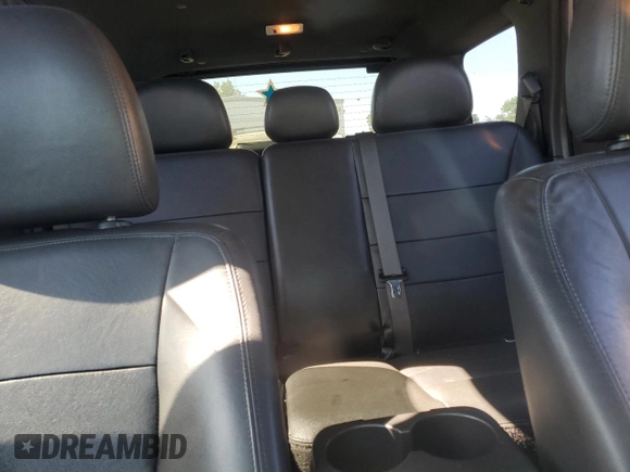2012 Ford Escape Limited z VIN 1FMCU9EG3CKA65246, wystawiony jako Copart lot #57762675 z przebiegiem 161 568 mil mil oraz Szkoda całkowita • Salvage title. Historia ofert i sprzedaży dostępna na DreamBid. Obrazek 10.