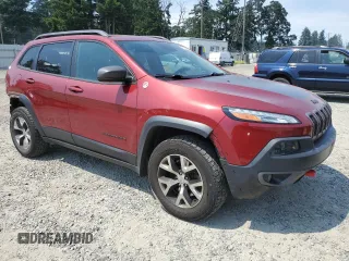 2015 Jeep Cherokee Trailhawk with VIN 1C4PJMBSXFW661218, listed as a Copart auction lot 61364895 with 139,200 mi miles and Salvage title. Bid and sale history available at DreamBid. Image 4.