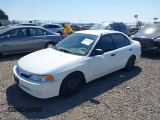 2000 Mitsubishi Mirage DE z VIN JA3AY26C4YU017932, wystawiony jako IAAI lot #42431603 z przebiegiem 193 139 mil mil oraz . Historia ofert i sprzedaży dostępna na DreamBid. Obrazek 2.