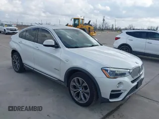 2015 BMW X4 xDrive28i with VIN 5UXXW3C53F0M88714, listed as a IAAI auction lot 41483692 with 132,054 mi miles. Bid and sale history available at carsss.com. Image 1.