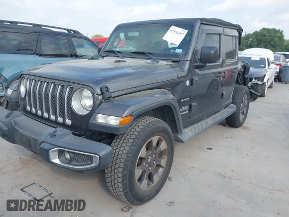 2018 Jeep Wrangler Unlimited Sahara z VIN 1C4HJXEG5JW194523, wystawiony jako IAAI lot #42056557 z przebiegiem 71 141 mil mil oraz . Historia ofert i sprzedaży dostępna na DreamBid. Obrazek 2.
