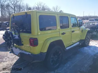 2023 Jeep Wrangler 4xe Sahara with VIN 1C4JJXP66PW580527, listed as a IAAI auction lot 41261127 with 15,100 mi miles. Bid and sale history available at carsss.com. Image 4.
