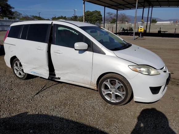 2010 Mazda 5 Sport with VIN JM1CR2WL3A0362695, listed as a Copart auction lot 54591605 with 188,534 mi miles and Salvage title. Bid and sale history available at DreamBid. Image 4.