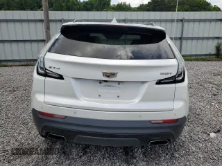 2019 Cadillac XT4 FWD Sport with VIN 1GYFZER44KF210582, listed as a Copart auction lot 61272015 with 104,073 mi miles and Salvage title. Bid and sale history available at DreamBid. Image 6.