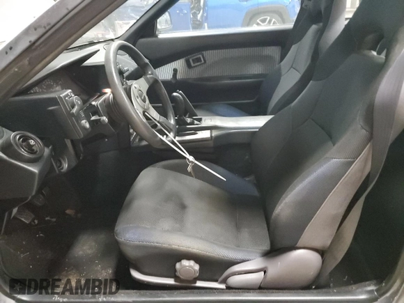 1989 Toyota MR2 z VIN JT2AW15C1K0150268, wystawiony jako Copart lot #86257134 z przebiegiem 93 969 mil mil oraz Tytuł czysty. Historia ofert i sprzedaży dostępna na DreamBid. Obrazek 7.