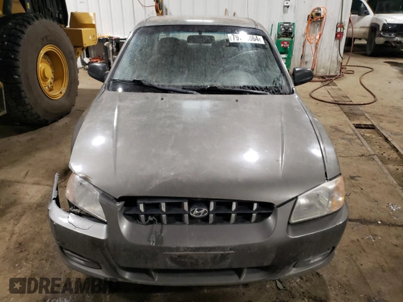 2000 Hyundai Accent z VIN KMHCG45G4YU090520, wystawiony jako Copart lot #79705864 z przebiegiem 145 490 mil mil oraz Szkoda całkowita • Salvage title. Historia ofert i sprzedaży dostępna na DreamBid. Obrazek 5.