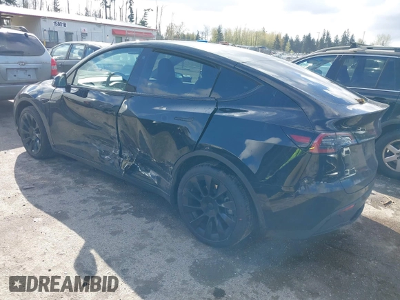 2022 Tesla Model Y Long Range with VIN 7SAYGDEEXNF459834, listed as a IAAI auction lot 42004576 with 56,175 mi miles and . Bid and sale history available at carsss.com. Image 3.